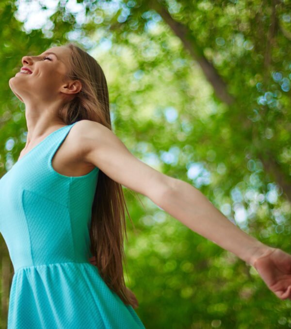 Photo of happy girl taking pleasure in summer day outside